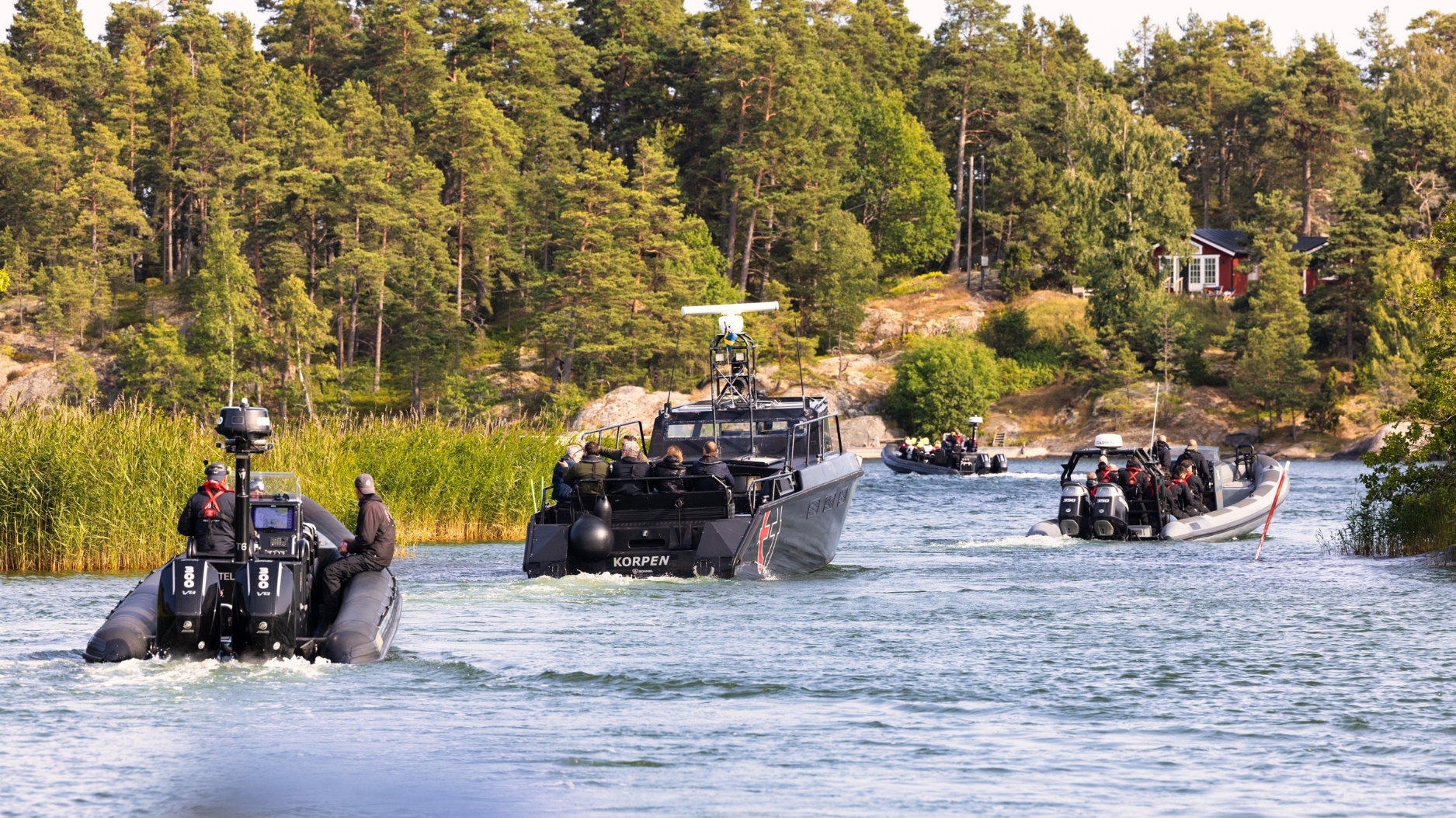 Convoy of RIB boats moving through the Stockholm archipelago